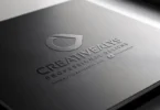 Download free stunning logo PSD mockup with embossed style on a black surface.