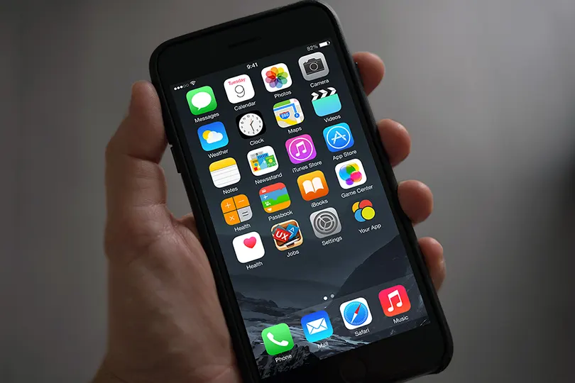 iPhone in Hand App Icon Mockup Free PSD