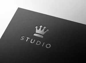 Premium silver embossed logo mockup on luxury dark paper with metallic foil texture.